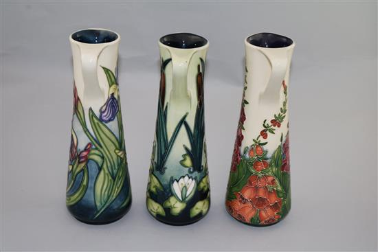Three Moorcroft cylindrical ewers in Limia, Iris and Foxglove patterns, 1995-2002, height 24cm